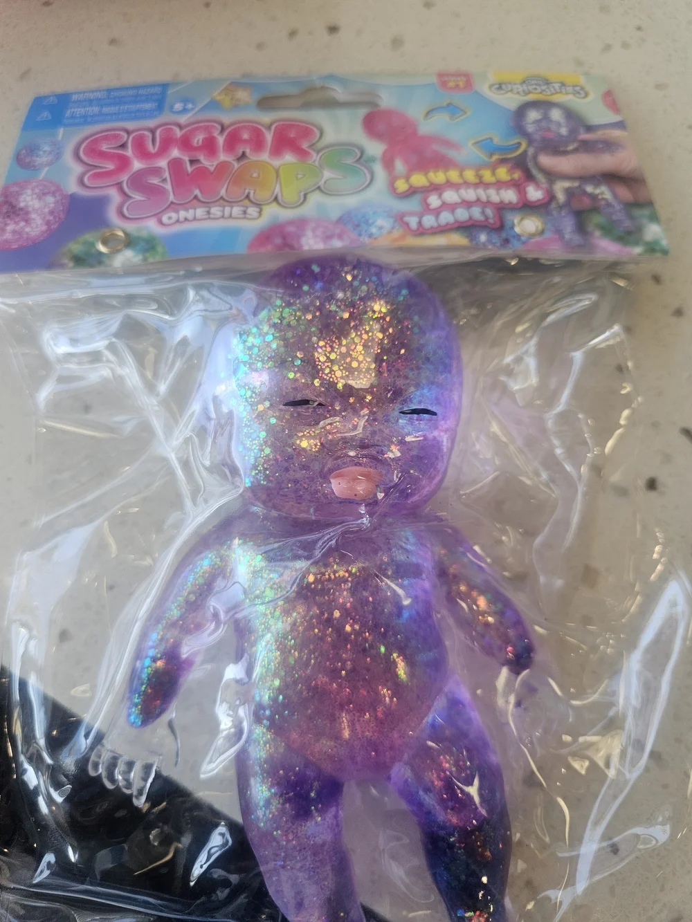 Onesies Purple Glitter Squeeze Baby Toy